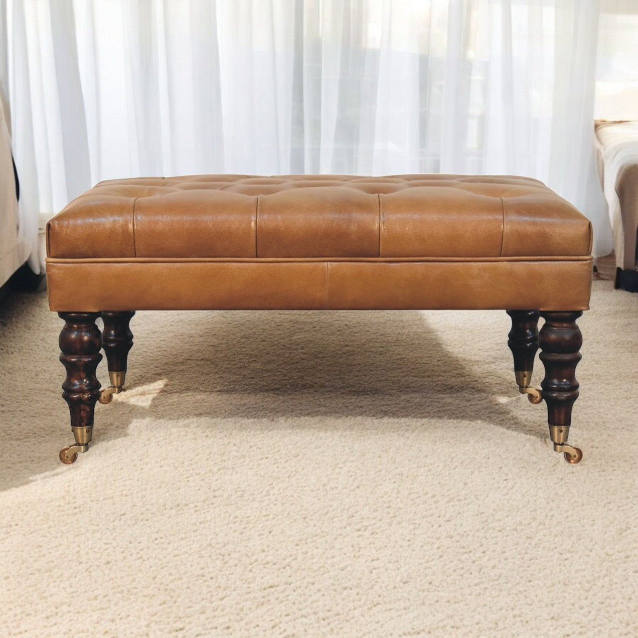 Hide Leather Ottoman with Castor Legs through Homepressions.com